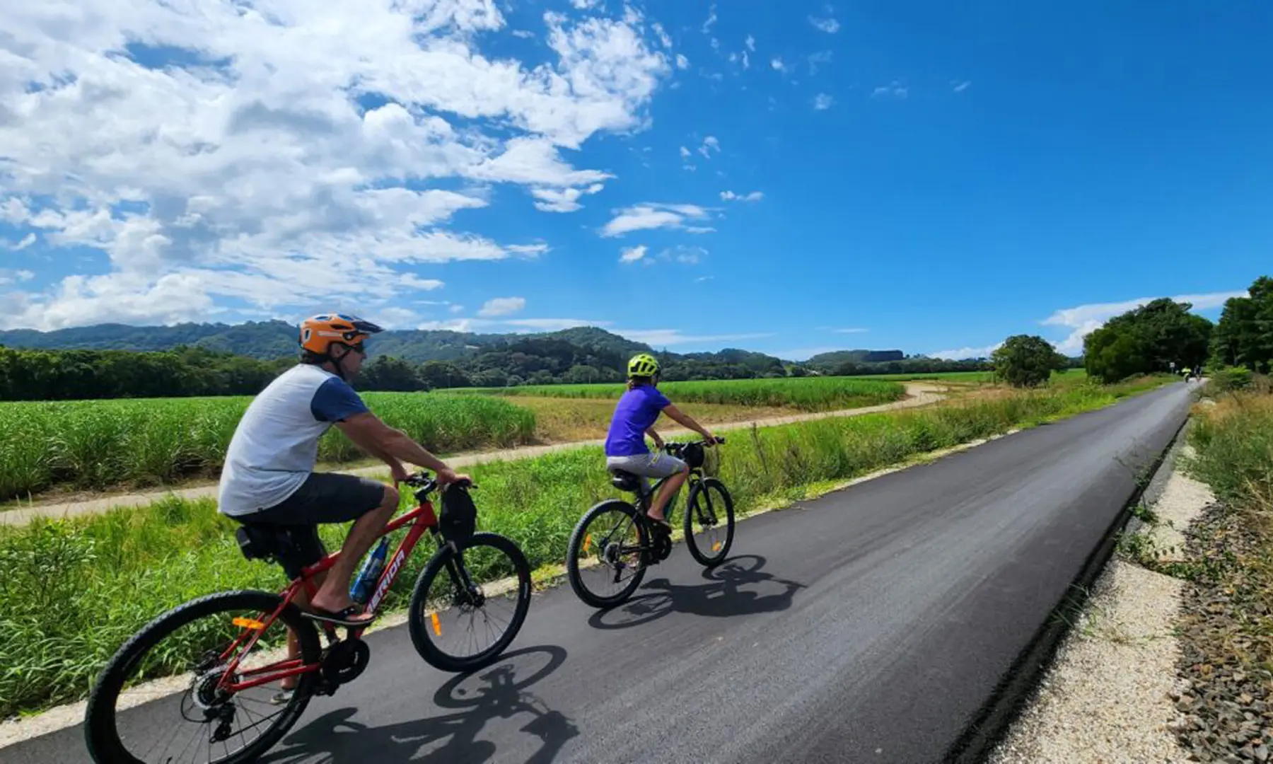 Riders on a sealed road.