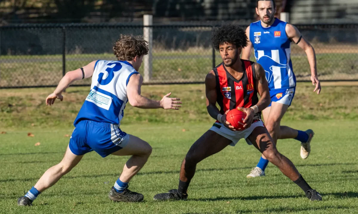 Maldon surrounded by defenders.
