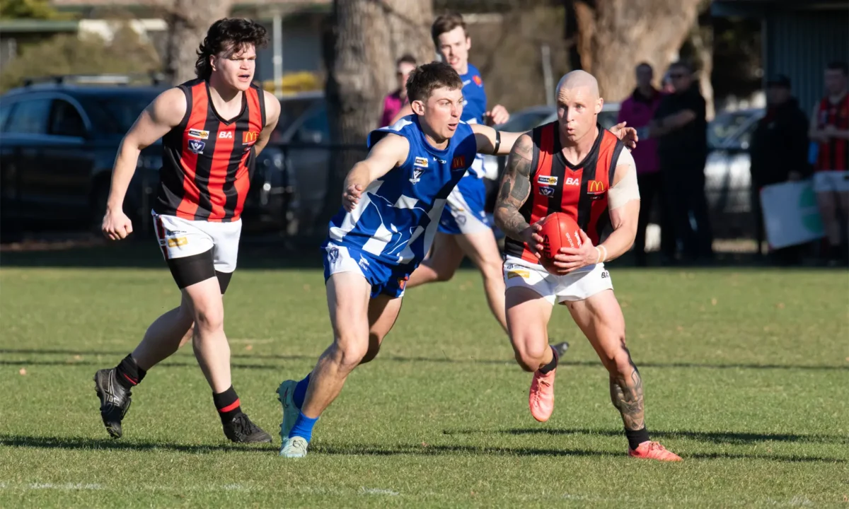 Maldon’s Damian Wust holds onto the ball, backed up by Seb Andrea, as Newstead comes in for the tackle. Photo courtesy of Rob Leeson.