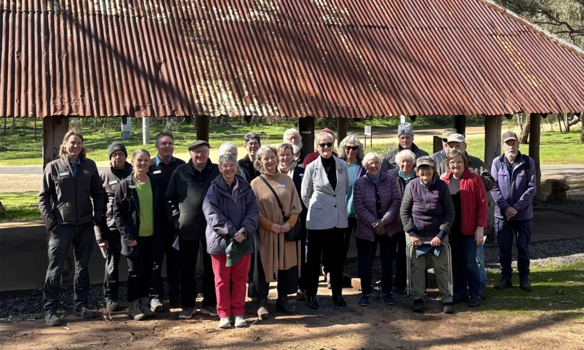 Members of Friends of Maldon Historic Reserve and other community members with Maree Edwards MP at the restored Butts Shelter.