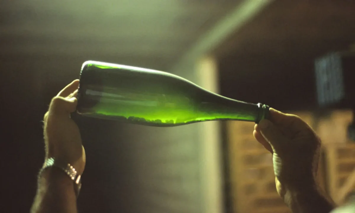 Champagne bottle with lees sediment prior to disgorgement.