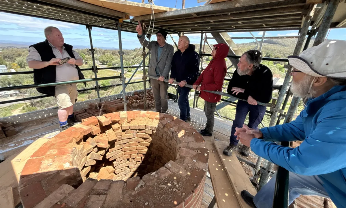 Builder Simon Davies explains the works to local stakeholders at the top of Maldon’s Beehive Chimney.