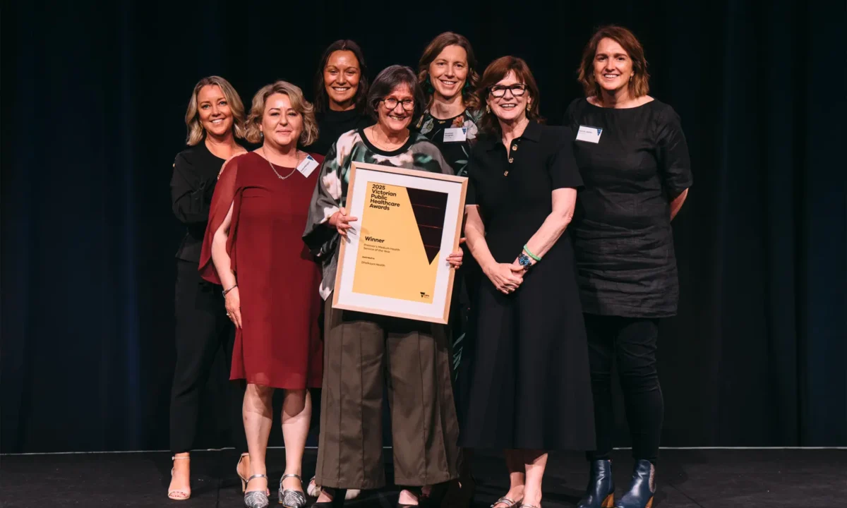 Dhelkaya Health staff accepting the award.