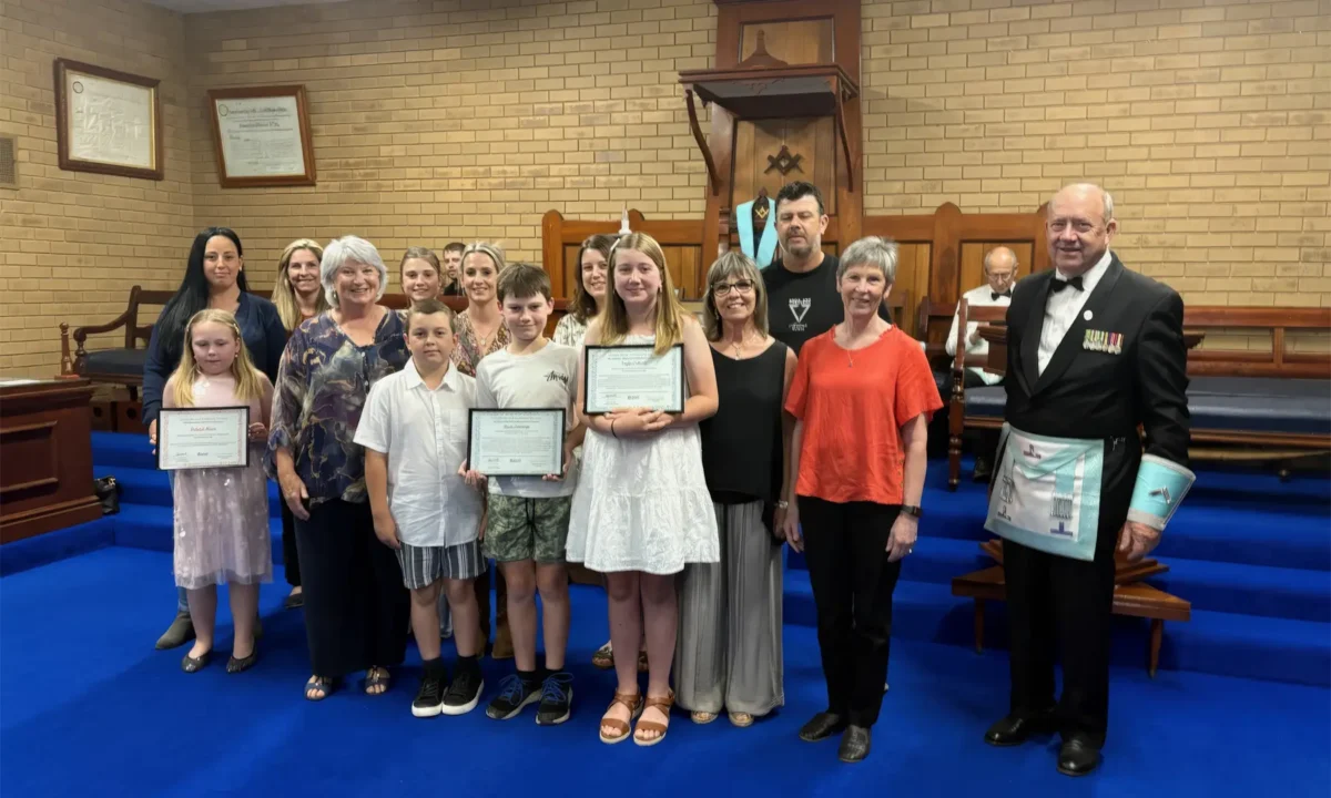 Southern Cross Masonic Lodge, Maldon, Master Clinton Breeze presents scholarships to students from Maldon Primary School.